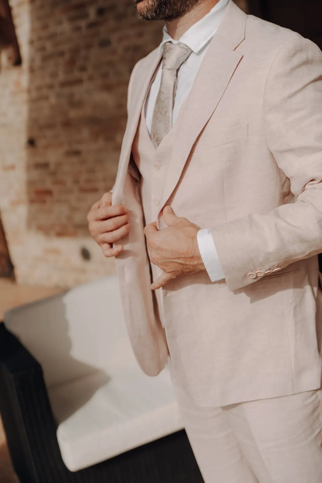 Groom in a light linen three-piece suit