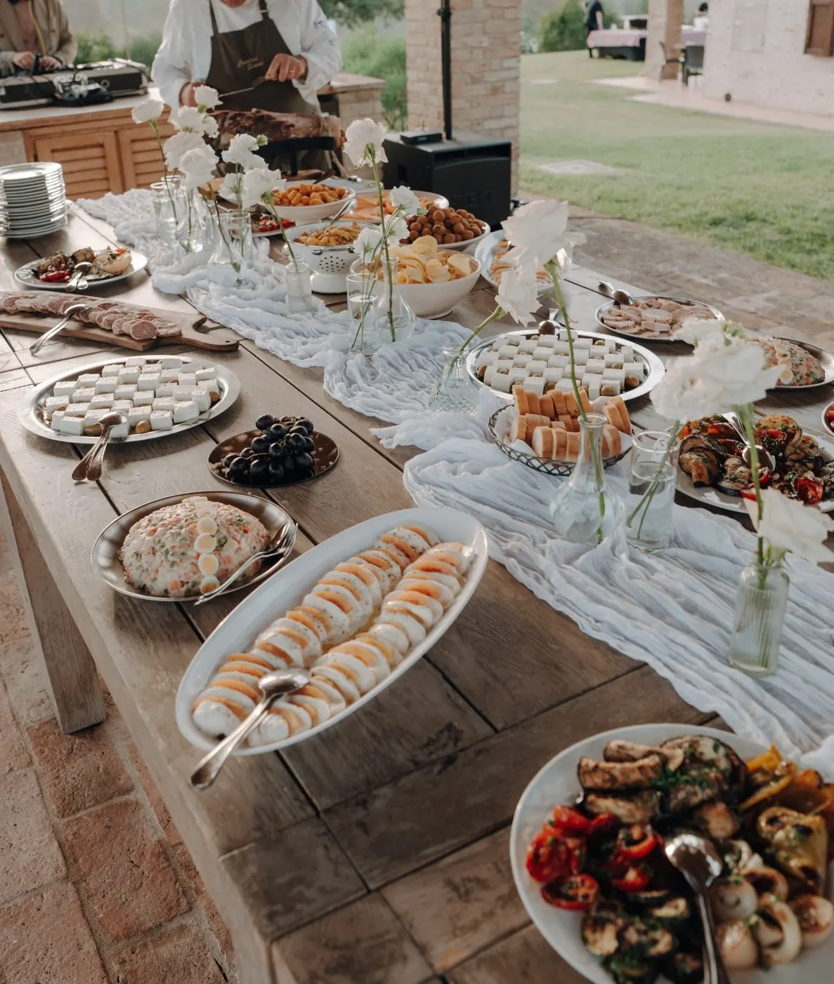 Wedding aperitivo buffet with local cheeses, cured meats and grilled vegetables in Le Marche